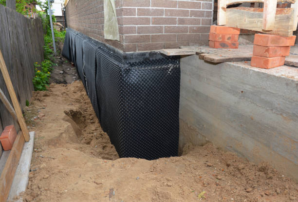 Happy homeowners after waterproofing job in Lincoln